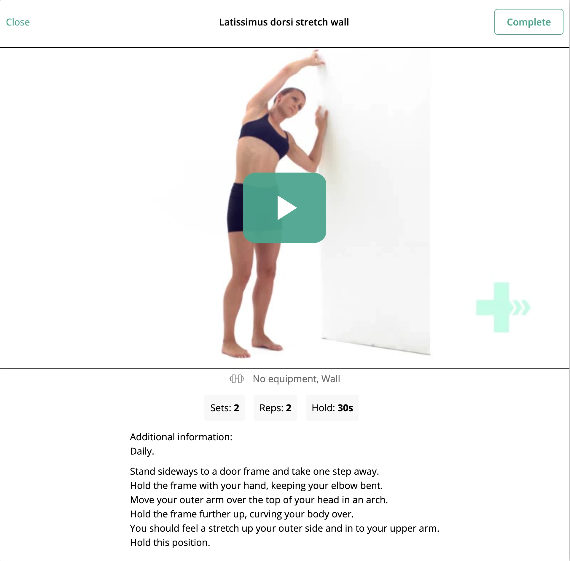 Latissimus dorsi stretch wall video screen showing exercise playback, dosage, equipment, and written instructions